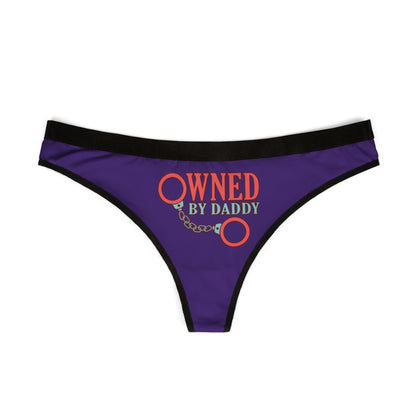 Elegant purple thong with black trim, showcasing a striking 'Owned by Daddy' graphic, ideal for cheeky gifting on special occasions.