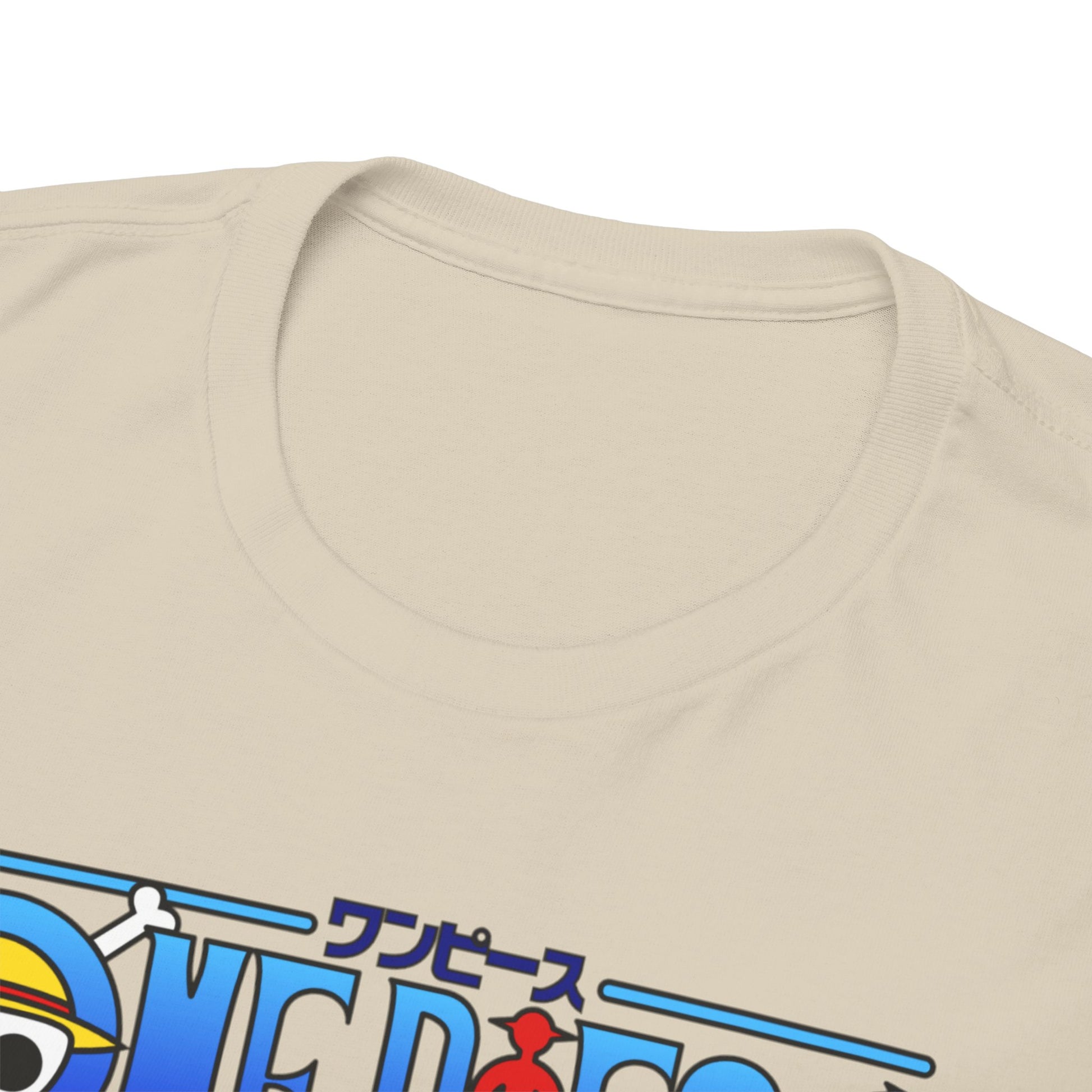 Refined beige t-shirt collar detail with vibrant One Piece logo, exemplifying luxury and comfort in anime-inspired fashion.