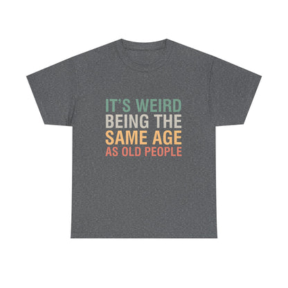 A refined heather grey urban unisex cotton T-shirt with the whimsical statement 'It’s Weird Being The Same Age As Old People', crafted for both comfort and a unique fashion statement.