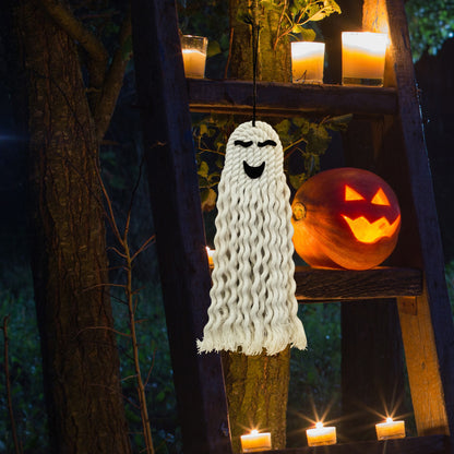 Sophisticated Halloween Ghost Hanging Decoration displayed outdoors with a glowing pumpkin, creating a whimsical and inviting atmosphere.