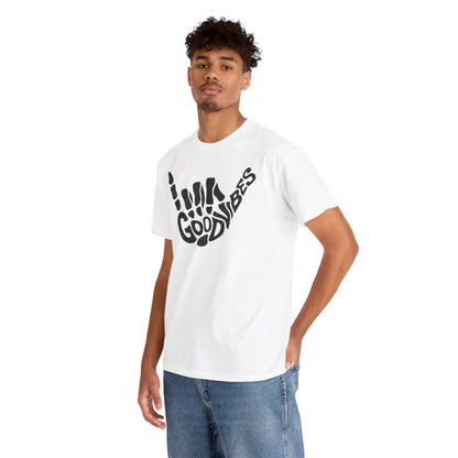 Sophisticated male model wearing a white t-shirt with a unique skeletal hand gesture design and 'GOOD VIBES' text, perfect for a casual yet stylish look.