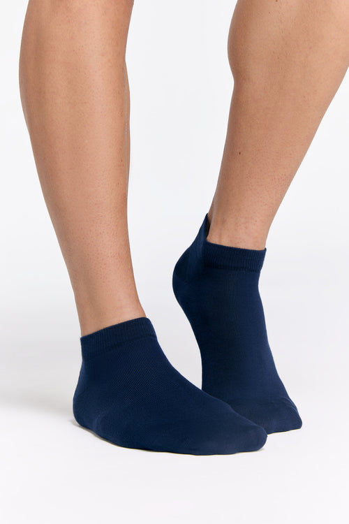 Assorted luxury organic cotton trainer socks in various shades, highlighting the premium quality and soft feel of 98% organic cotton.