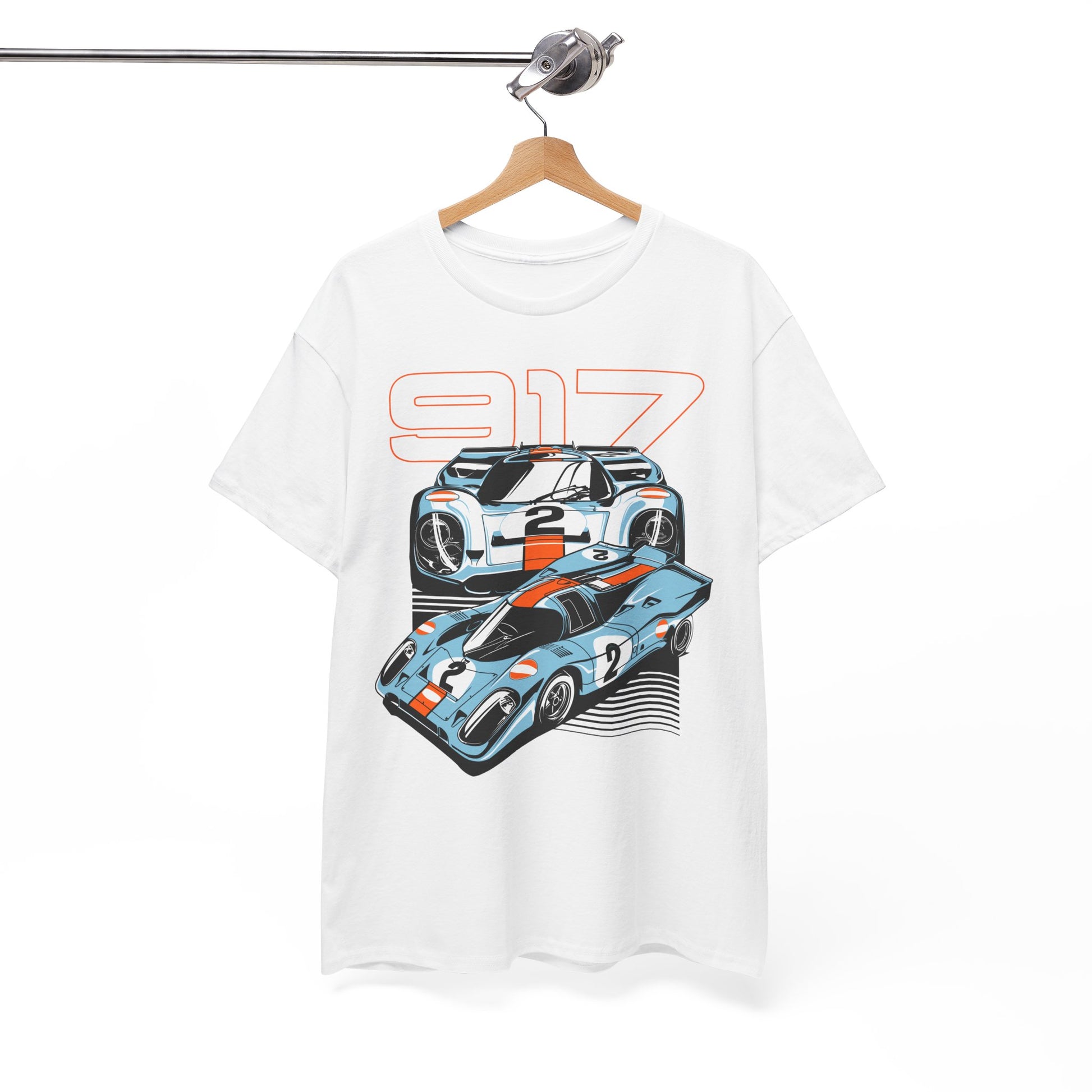 Refined white Porsche 917 graphic t-shirt displayed on a hanger, featuring a vivid illustration of race cars, symbolising a passion for luxurious automotive history.