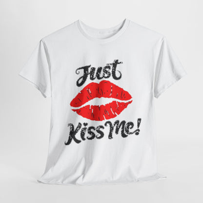 Stylish unisex white graphic t-shirt featuring the playful phrase 'Just Kiss Me!' accompanied by a vivid red lipstick kiss, perfect for casual gatherings and expressing a light-hearted charm.
