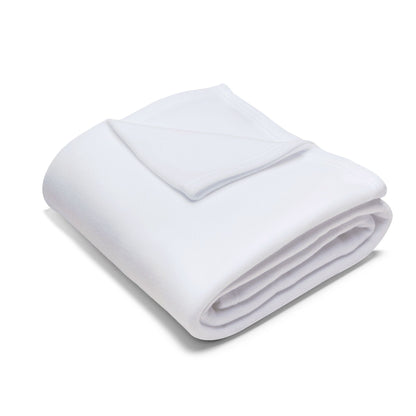 Neatly folded Decorative and Warm Christmas Arctic Fleece Blanket, highlighting its plush texture and pure white finish, ideal for luxury home decor during the holiday season.