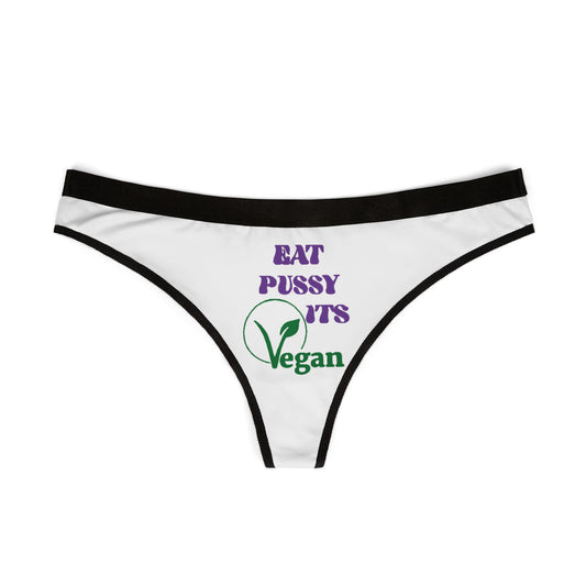 Elegant white thong panties with a bold graphic design displaying 'Eat Pussy, It's Vegan' in a striking font, crafted for the modern, fun-loving woman.