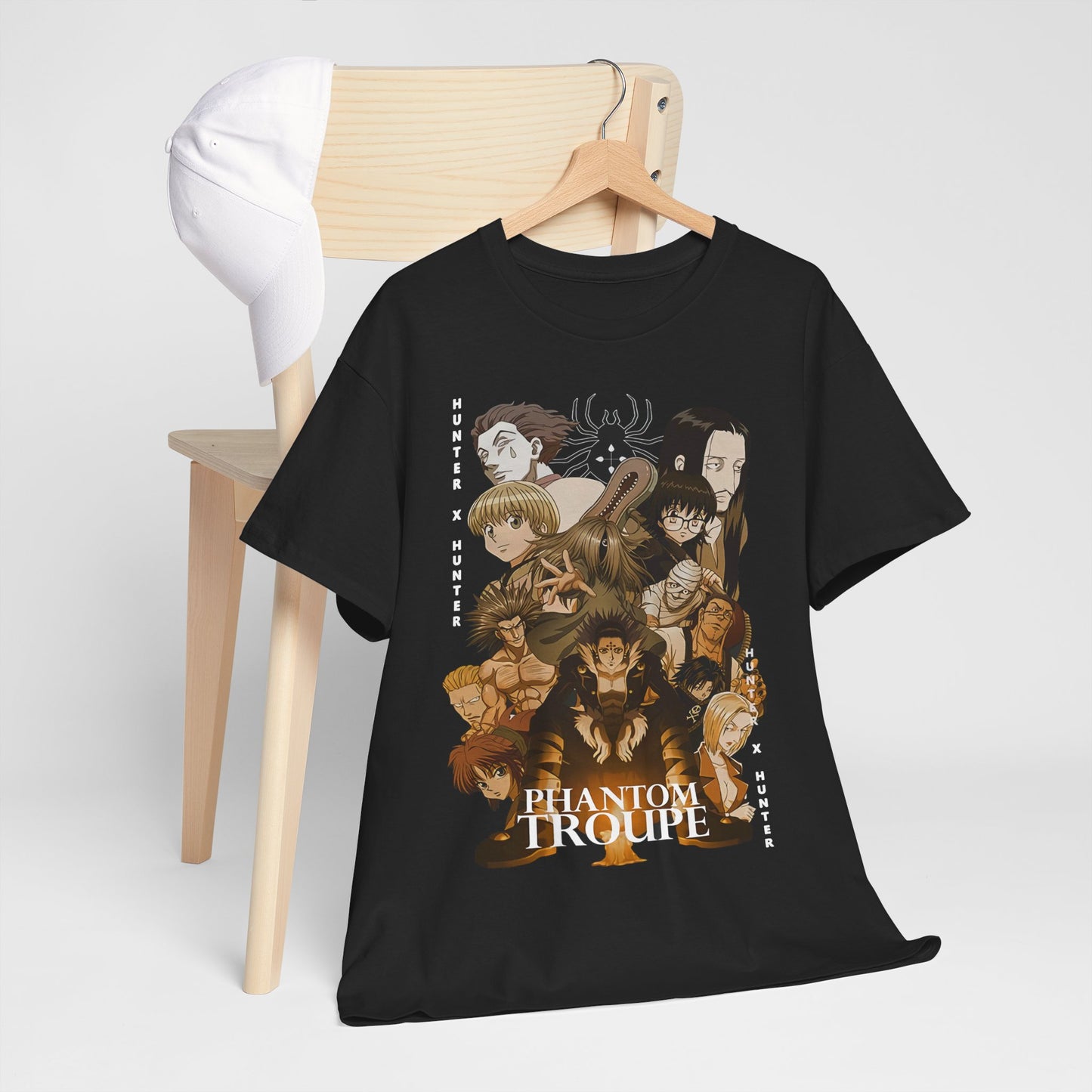 Stylish Phantom Troupe t-shirt elegantly displayed on a wooden chair, featuring captivating anime artwork from Hunter x Hunter.