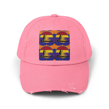 Unisex Distressed Paddleboarders Cap in pink with a striking paddleboarding illustration, combining fashion and functionality for outdoor adventures.