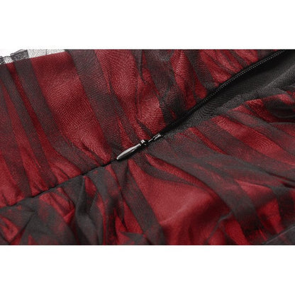 The Lilith Gothic Gown displayed elegantly on a mannequin emphasizing the floor-length design and dramatic movement of the mesh panels.