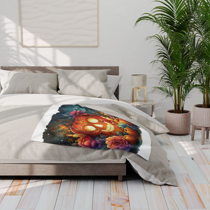 Chic Decorative and Warm Halloween Spooky Arctic Fleece Blanket artistically positioned on a plush bed, highlighting a captivating skull design embellished with enchanting floral elements.