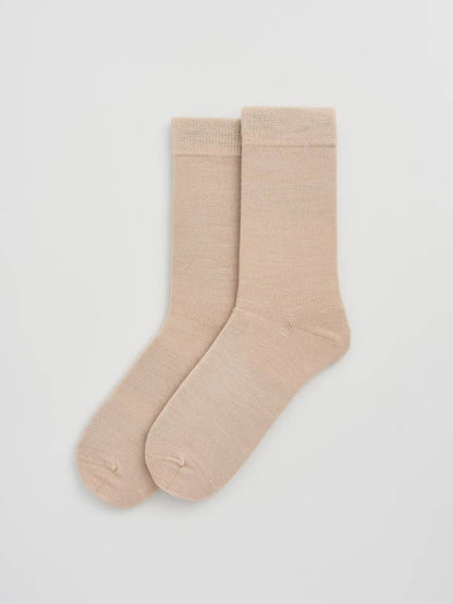 A sophisticated collection of Merino wool socks, embodying unmatched softness and odour-resistance for discerning customers.