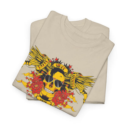 Folded beige t-shirts featuring a striking yellow skull design with wings and flowers, presented in a chic and stylish manner.