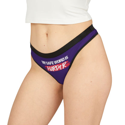 Stylish women's thong featuring the cheeky phrase 'MY SAFE WORD IS HARDER', tailored for bold confidence and crafted in rich purple fabric, ideal for luxury and laughter in intimate attire.