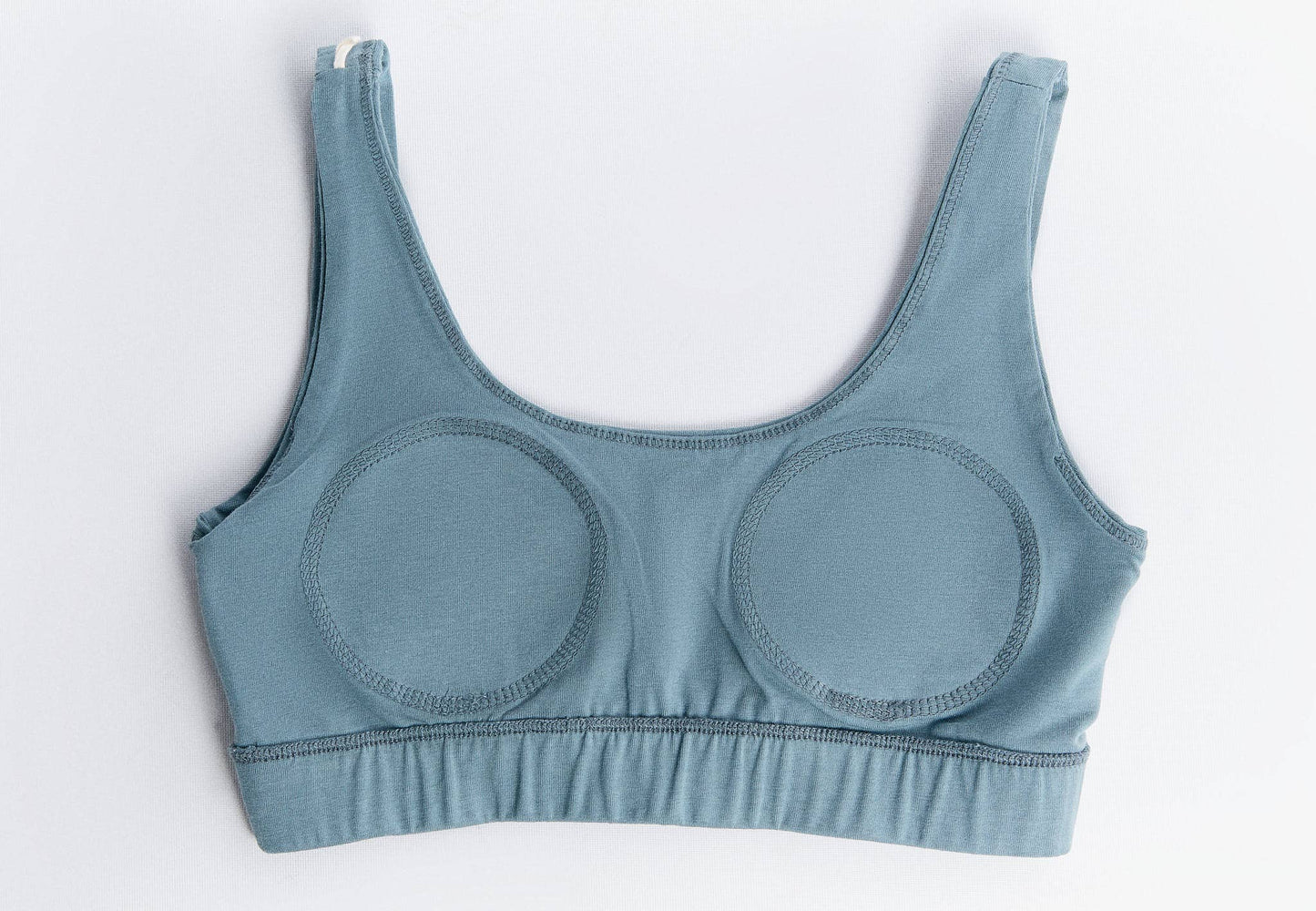 Close-up of the breathable fabric of the sustainable padded bralette, highlighting its gentle stretch and comfort.