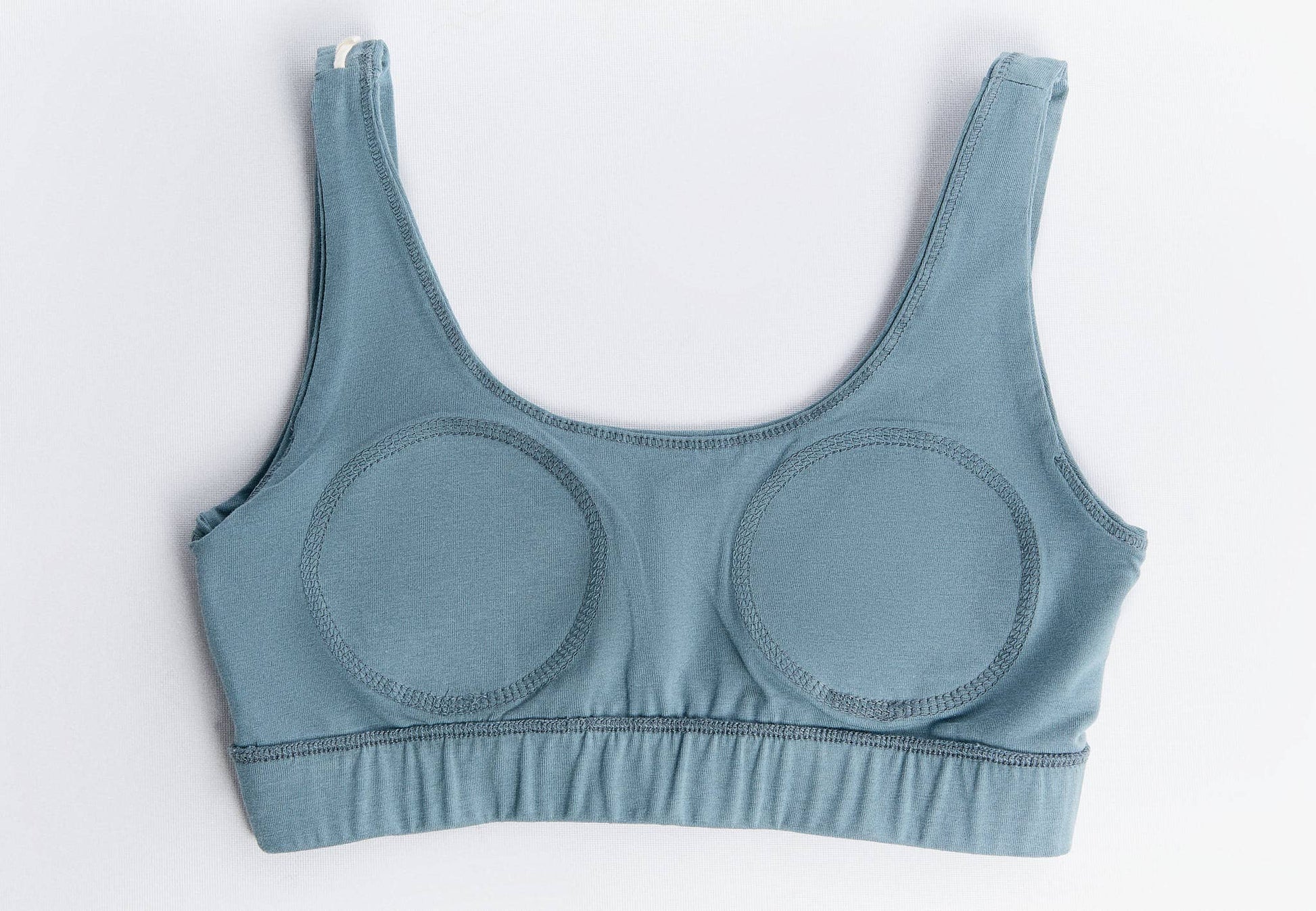 Close-up of the breathable fabric of the sustainable padded bralette, highlighting its gentle stretch and comfort.