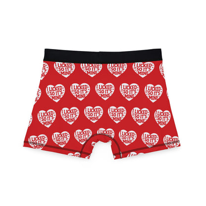 Reverse view of Valentine's Naughty Cheeky Men's Boxer Briefs featuring a vibrant red background adorned with hearts and the cheeky message 'I LICKED IT SO IT'S MINE', ideal for a fun and romantic gift.