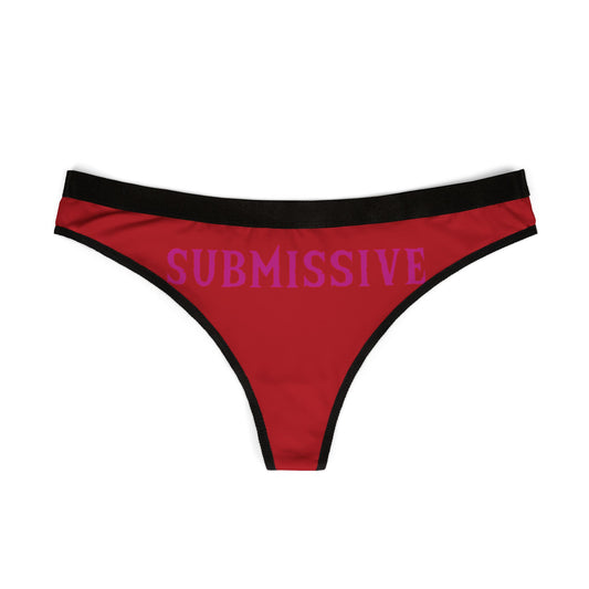 Luxury women's thong in vibrant red featuring bold purple lettering "SUBMISSIVE", designed for playful intimate moments.