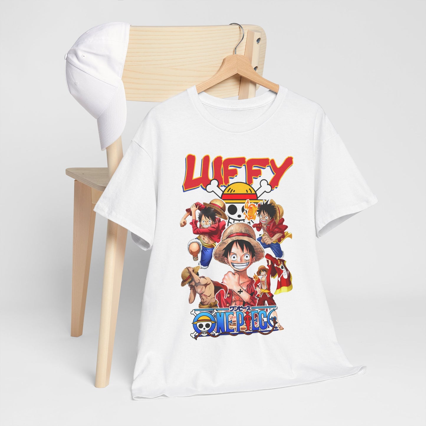 Luxurious Luffy & Crew graphic T-shirt displayed on a minimalist wooden hanger with a stylish cap, featuring vibrant anime-inspired artwork celebrating One Piece.