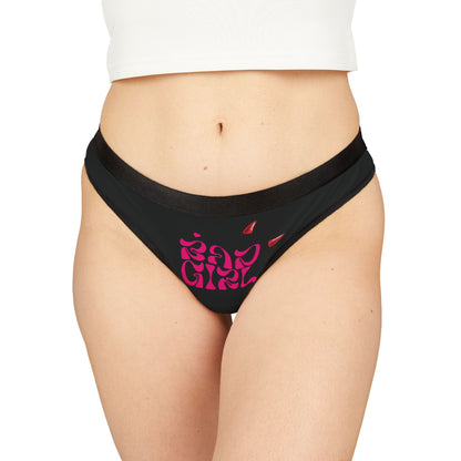 Luxurious black thong panties featuring bold hot pink 'Bad Girl' graphic and playful devil horns, designed for a cheeky and confident aesthetic.