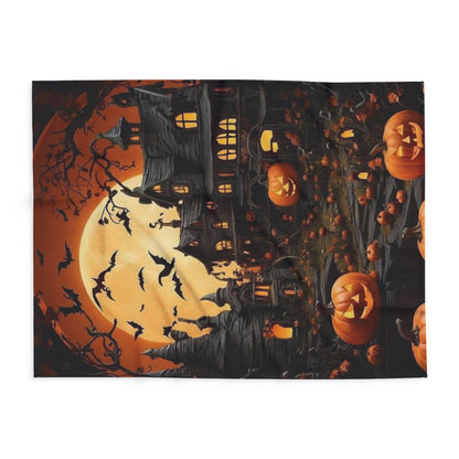 Luxurious Decorative and Warm Halloween Spooky Arctic Fleece Blanket featuring a haunted mansion, pumpkins, and bats, ideal for seasonal decor and cozy comfort.