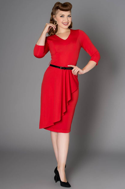Luxurious Timeless London Katie red polyester dress featuring a sophisticated V-neckline, chic quarter sleeves, and a flowing waterfall skirt design, complemented by a sleek black belt with a silver buckle.