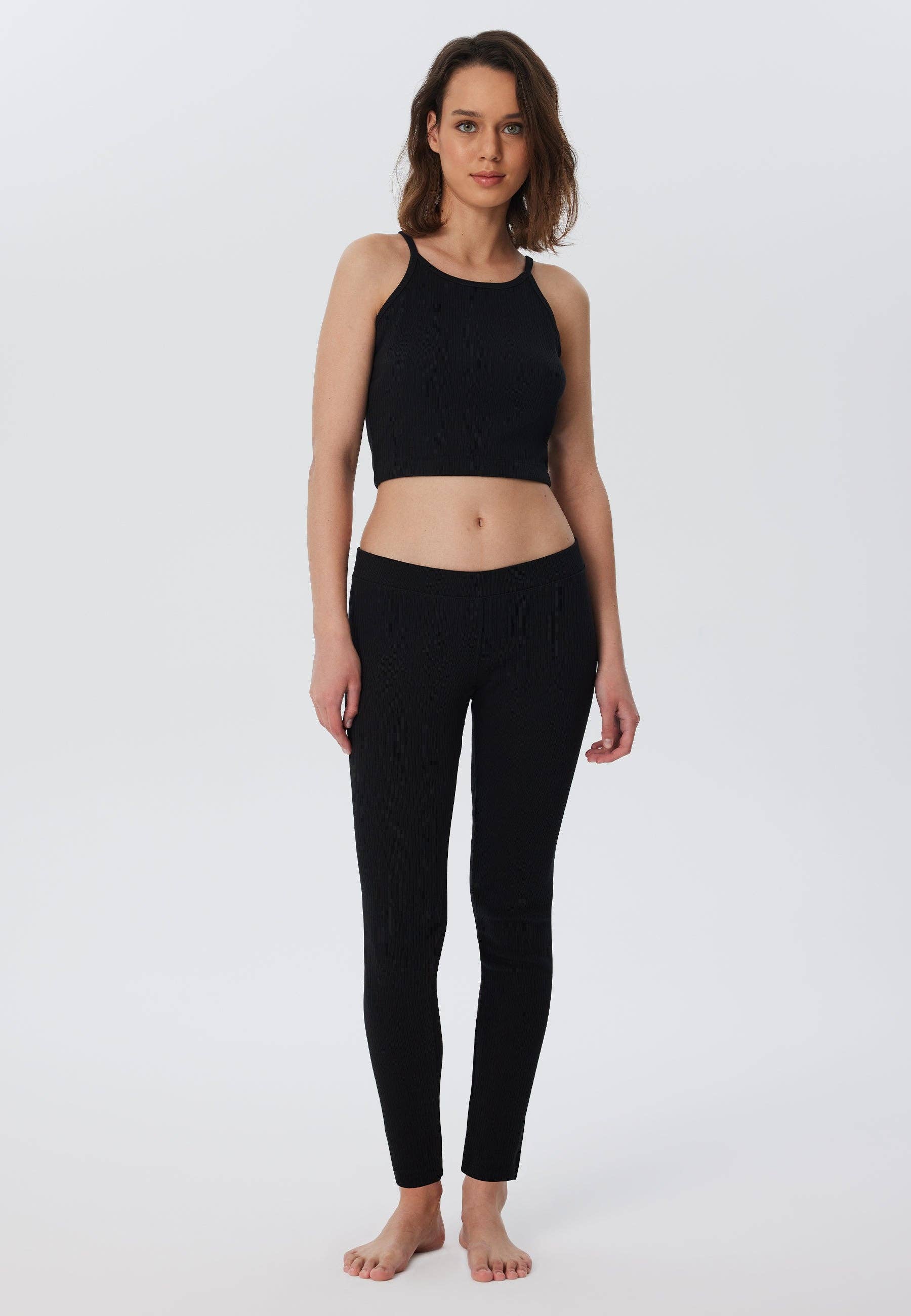 Luxurious organic cotton ribbed leggings for women featuring a soft elasticated waist, designed for ultimate comfort and style.