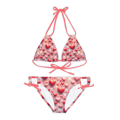Elegant Pastel Pink Strappy Bikini Set adorned with glittering hearts by Dazzling Dreams Studio, perfect for fashionable summer beach outings.
