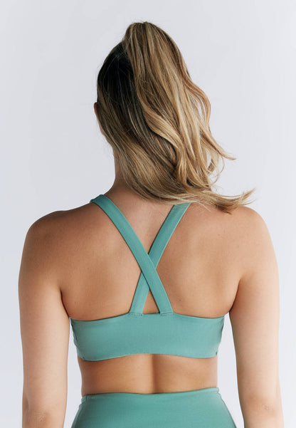 Elegant luxury organic cotton and recycled elastane V-neck padded sports bra, showcasing comfort and style for both sports and everyday wear.
