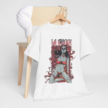 Vibrant La Muerte graphic t-shirt design featuring a captivating sugar skull art on a white background, hung on a wooden hanger next to a stylish cap.
