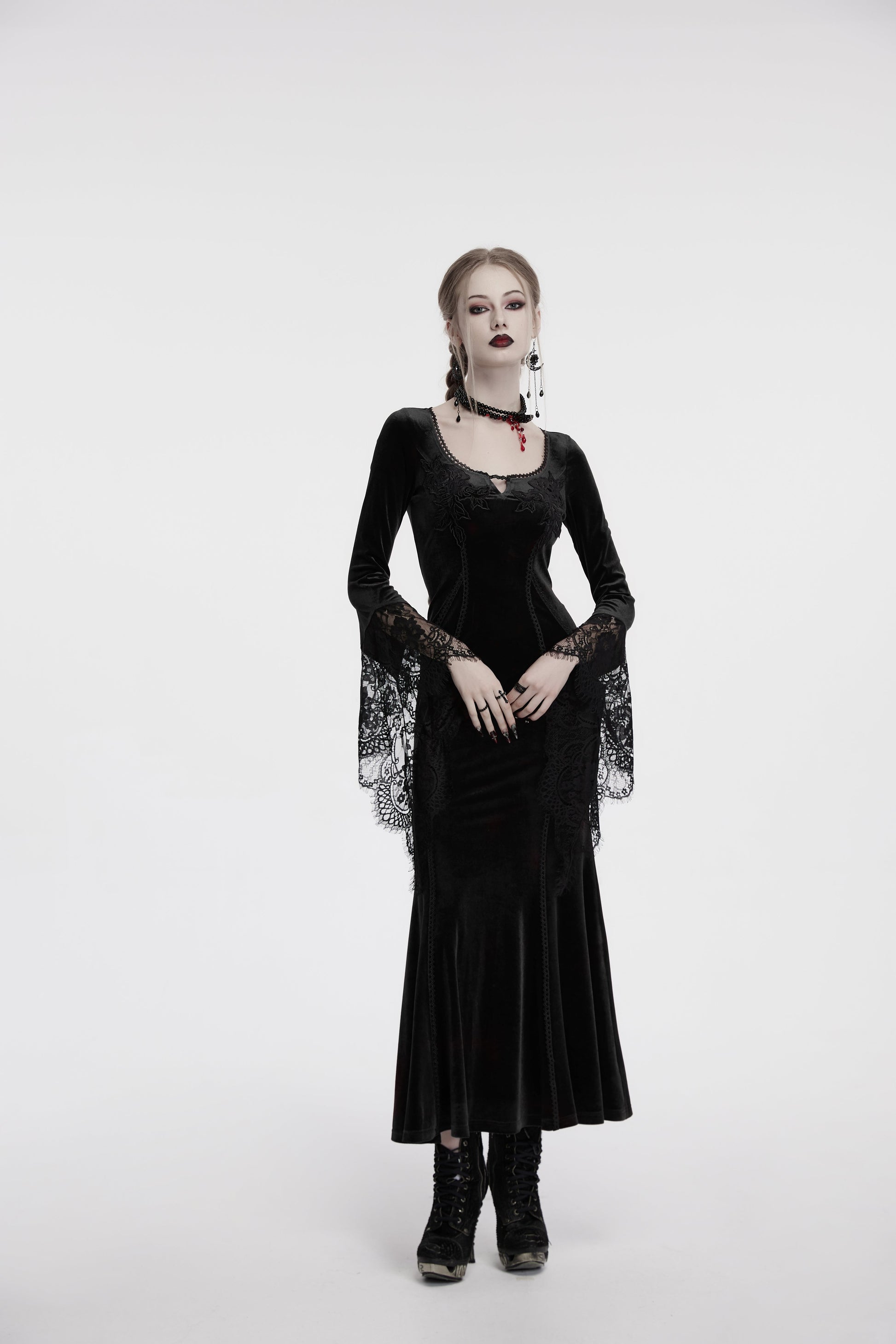 Model wearing the Punk Rave Isolde Dress, showcasing the luxurious fabric and enchanting silhouette in a gothic-inspired setting.