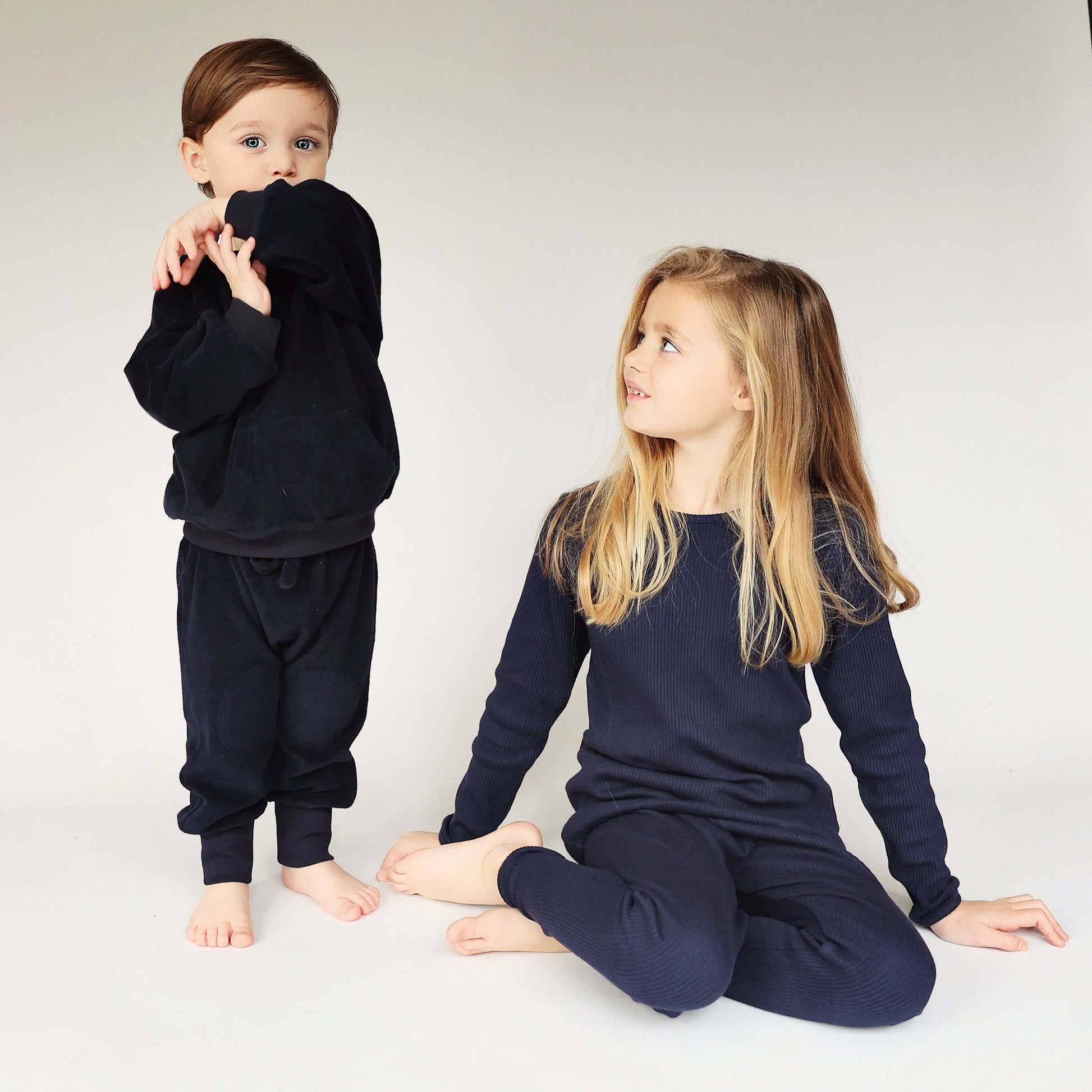 Elegant display of DreamBuy's Oxford Blue matching pajamas, crafted from soft, breathable cotton, ideal for all family members, enhancing comfort and style for cosy nights.