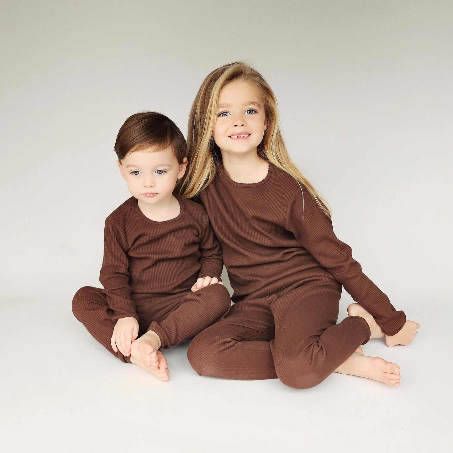 Luxurious chocolate family matching pajamas by DreamBuy, featuring soft cotton fabric, available in sizes from newborn to adult XXL.
