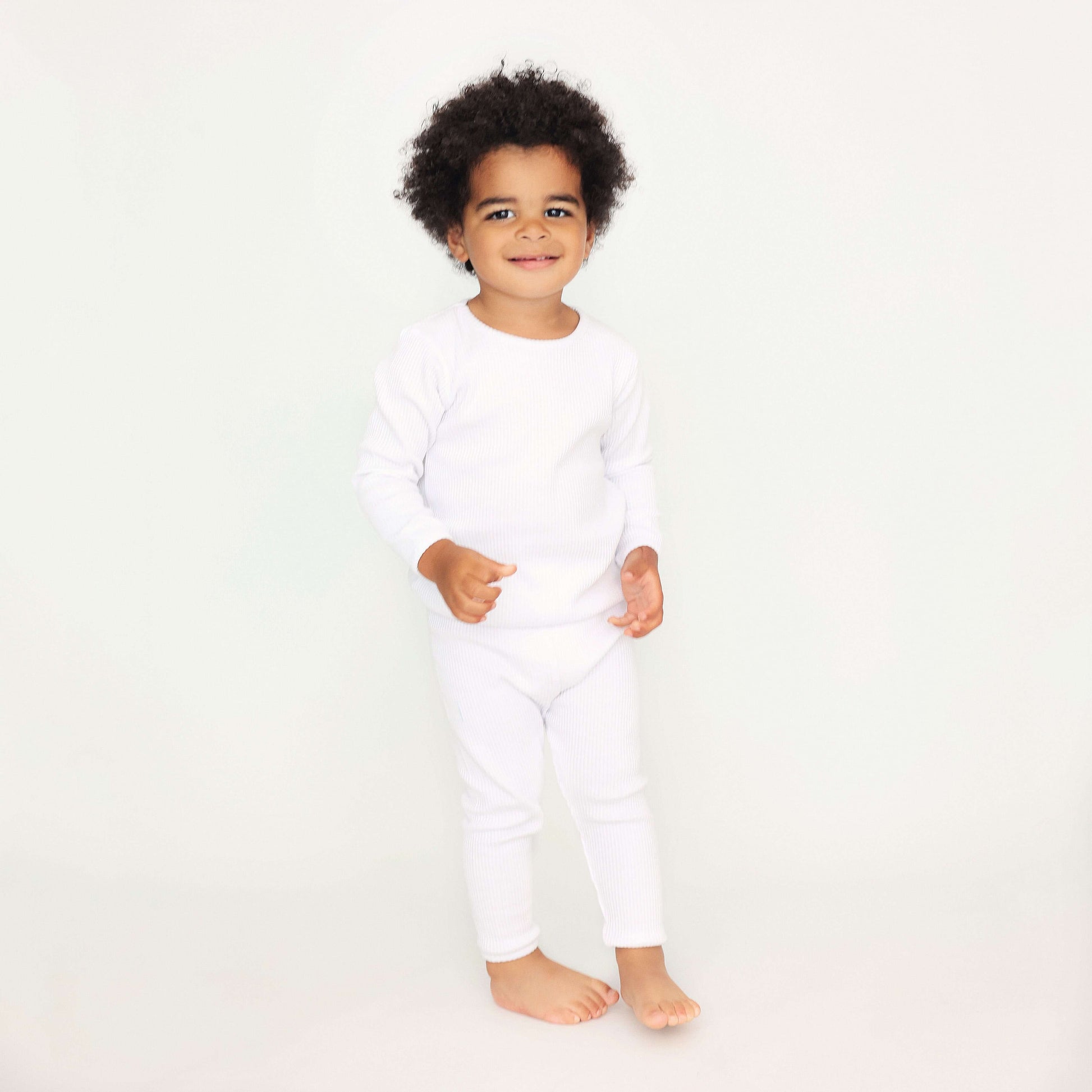 Luxury white matching family PJs by DreamBuy, showcasing soft and comfortable unisex pajamas for all sizes, perfect for cozy family nights.