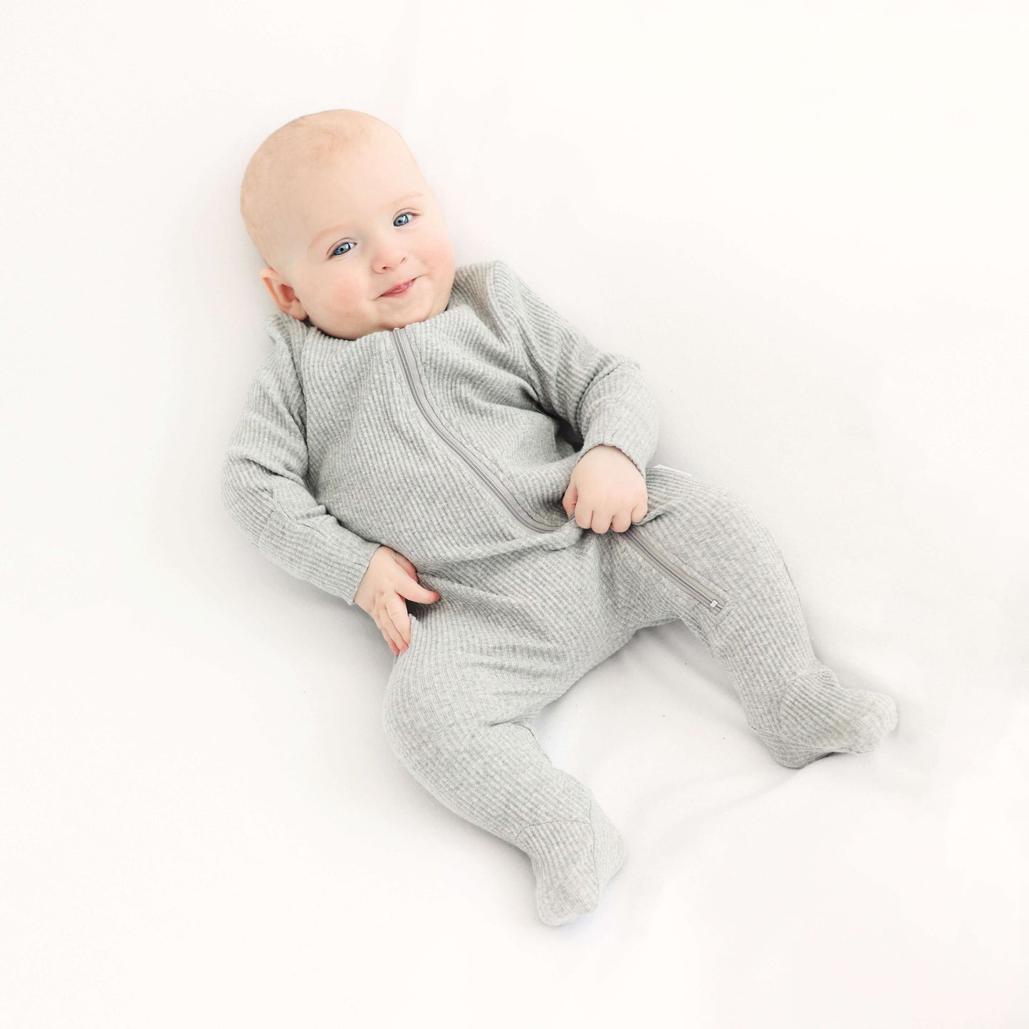 Cozy Dove Grey Sleepsuit for toddlers by DreamBuy, with a stylish zip closure for a snug fit.