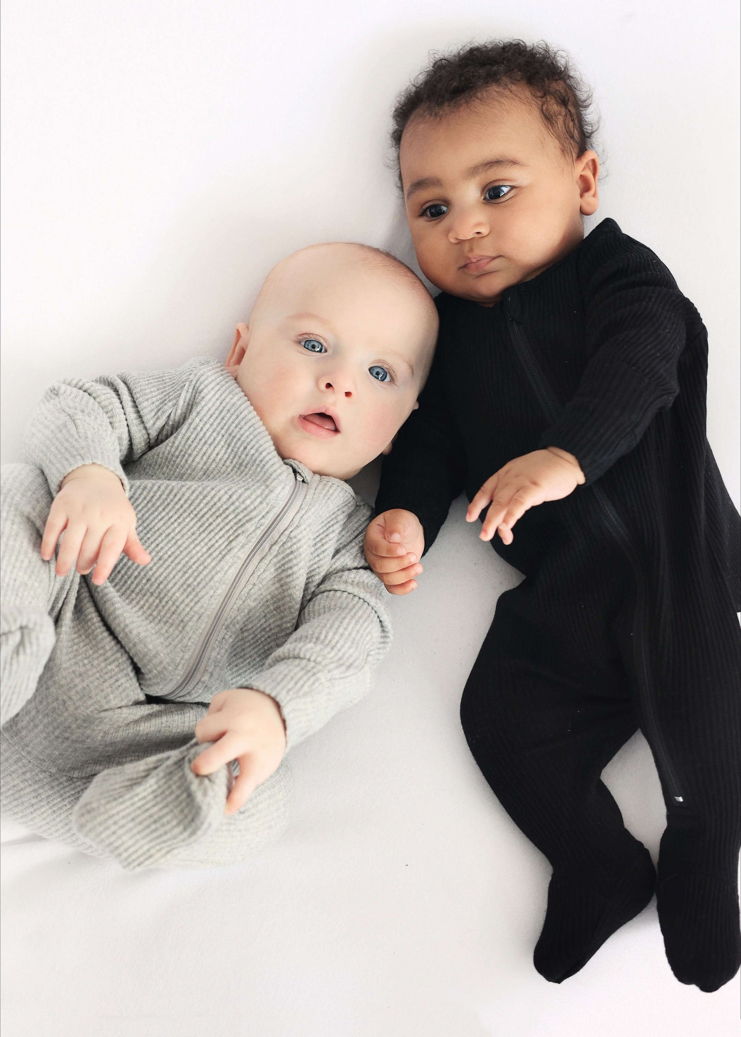 Luxurious Dove Grey Zip Sleepsuit for newborns by DreamBuy, showcasing soft fabric and adjustable zip closure for ultimate comfort.