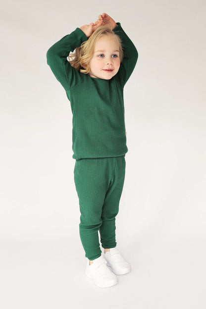 Luxury family matching pyjamas in forest green by DreamBuy, made from soft cotton blend, showcasing sizes for everyone from 3 months to XXL.