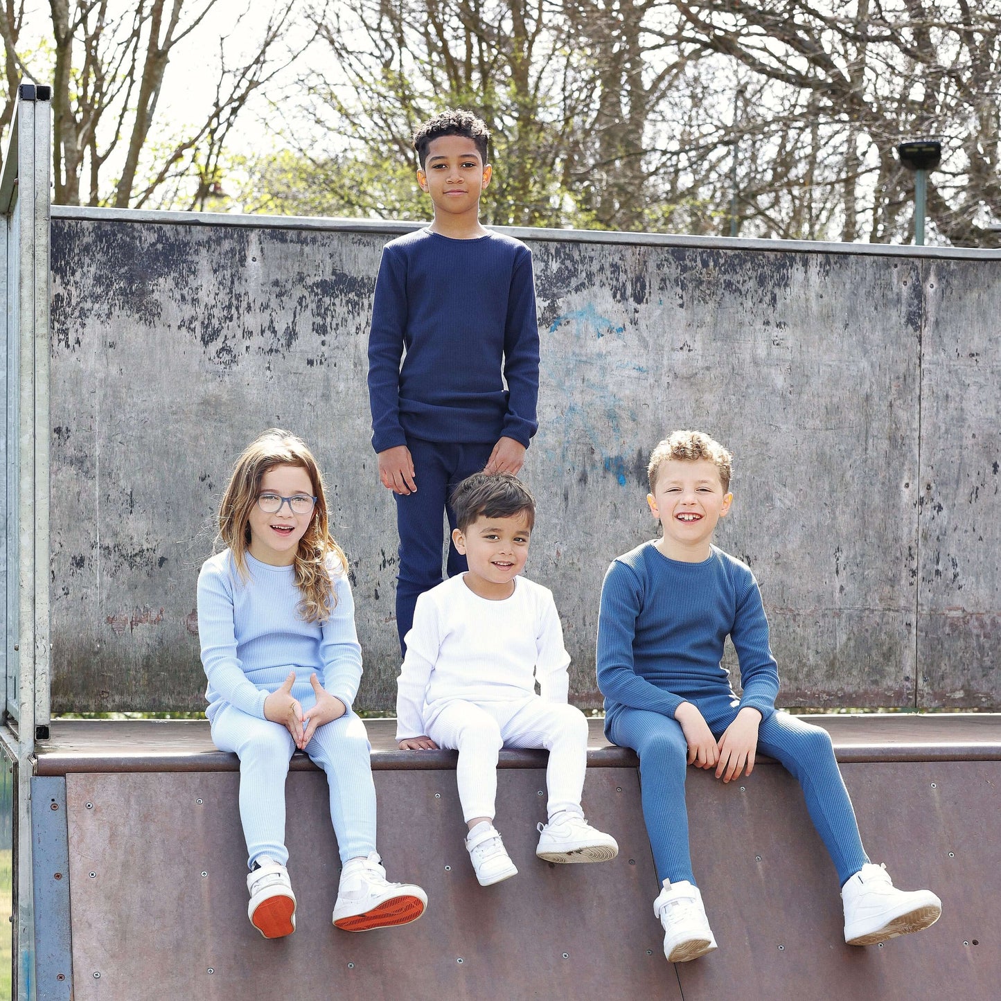 Comfortable Oxford Blue matching pajamas for the entire family by DreamBuy, designed in breathable cotton, ideal for year-round wear and elegant gift giving.