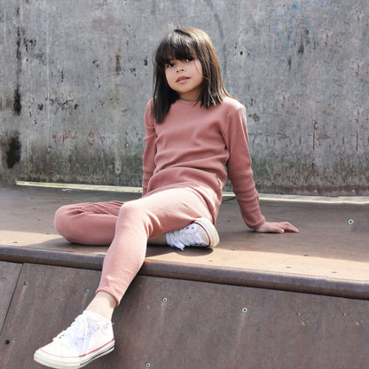 Luxury ribbed family Christmas pyjamas set in leather pink by DreamBuy, showcasing matching outfits for all ages from 3 months to XXL, designed for comfort and style.