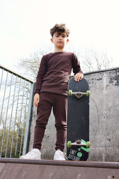 Family Matching Aubergine Pyjamas by DreamBuy - Soft cotton blend loungewear for adults and children, perfect for festive occasions.