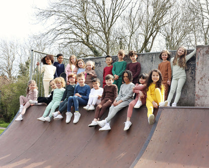 Luxury white matching family pajamas by DreamBuy, crafted from soft 95% cotton for ultimate comfort, showcasing a stylish and unisex design suitable for all ages.