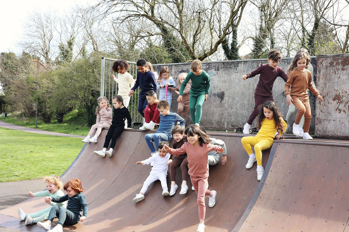 Elegant family portrait in DreamBuy luxury Velvet Mocha pyjamas, highlighting the ease and comfort for play or relaxation.