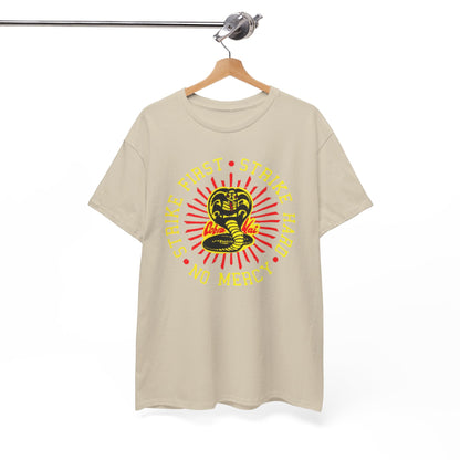 Elegantly displayed Cobra Kai t-shirt hanging on a wooden hook, featuring striking graphics and the classic martial arts motto for stylish casual occasions.