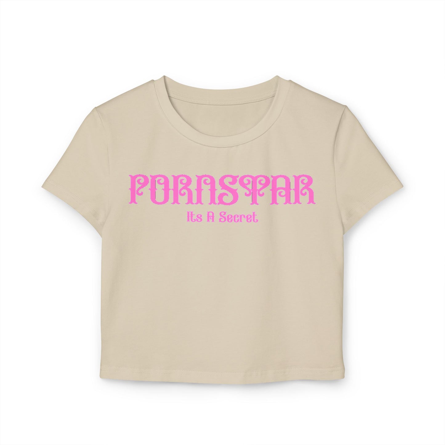 Chic beige cropped t-shirt displaying the fun text 'Pornstar It's A Secret' in a vibrant pink vintage style font, designed for comfort and casual elegance.