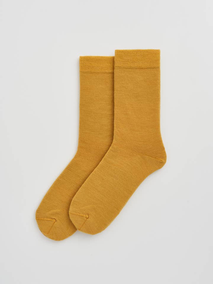 Sophisticated display of odour-resistant Merino Wool calf-length socks, designed for a perfect fit and unparalleled comfort.