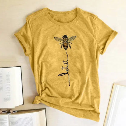 Close-up view of the Bee Kind Women's Graphic Tee by Dazzling Dreams Studio, highlighting the soft fabric and intricate graphic detail.