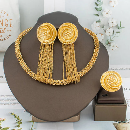 Close-up of stunning gold tassel earrings from the luxury 3-piece African fashion jewelry set.