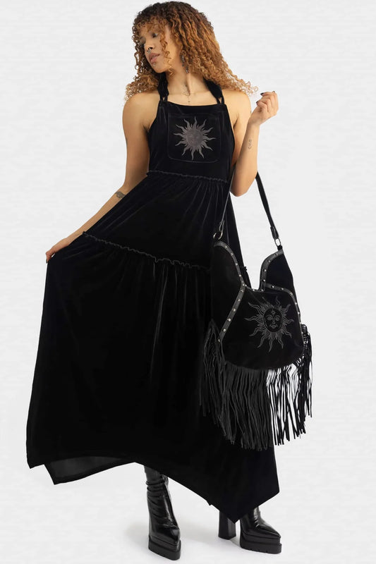 Luxurious Killstar Ascended Velvet Maxi Pinafore Dress featuring celestial sun embroidery, showcasing its flowing design and adjustable straps for the perfect fit.