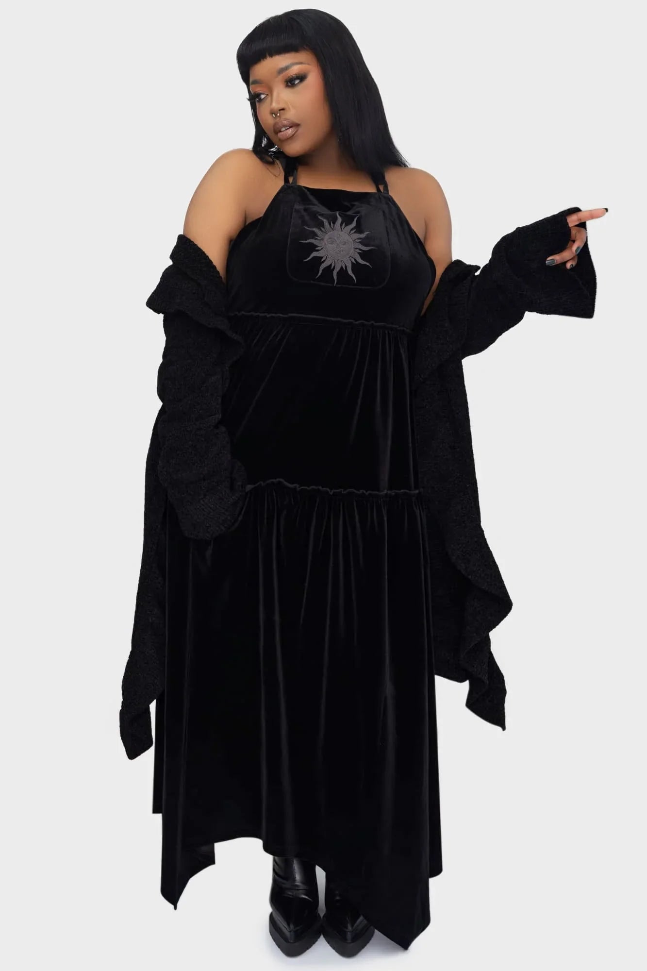 Tiered skirt design of the Killstar Ascended Velvet Maxi Pinafore Dress, exuding a flowing and mystical aesthetic for a captivating look.
