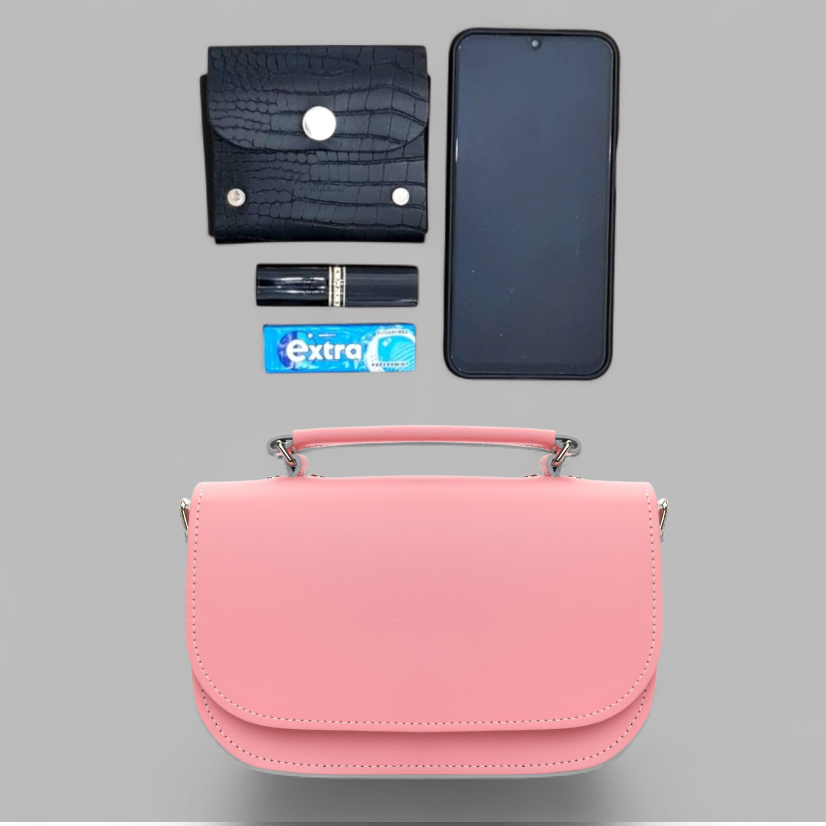 Interior view of the Aura Pastel Pink Handmade Leather Handbag, highlighting its spacious compartment and secure magnetic fastener for everyday essentials.