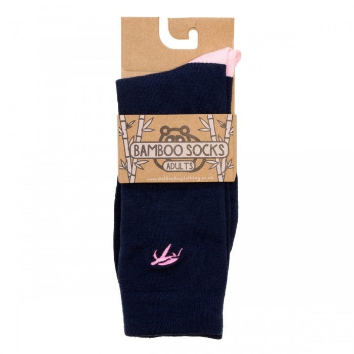 Close-up view of luxurious navy and pink bamboo socks, highlighting the fine texture and antibacterial properties for healthier, fresher feet.